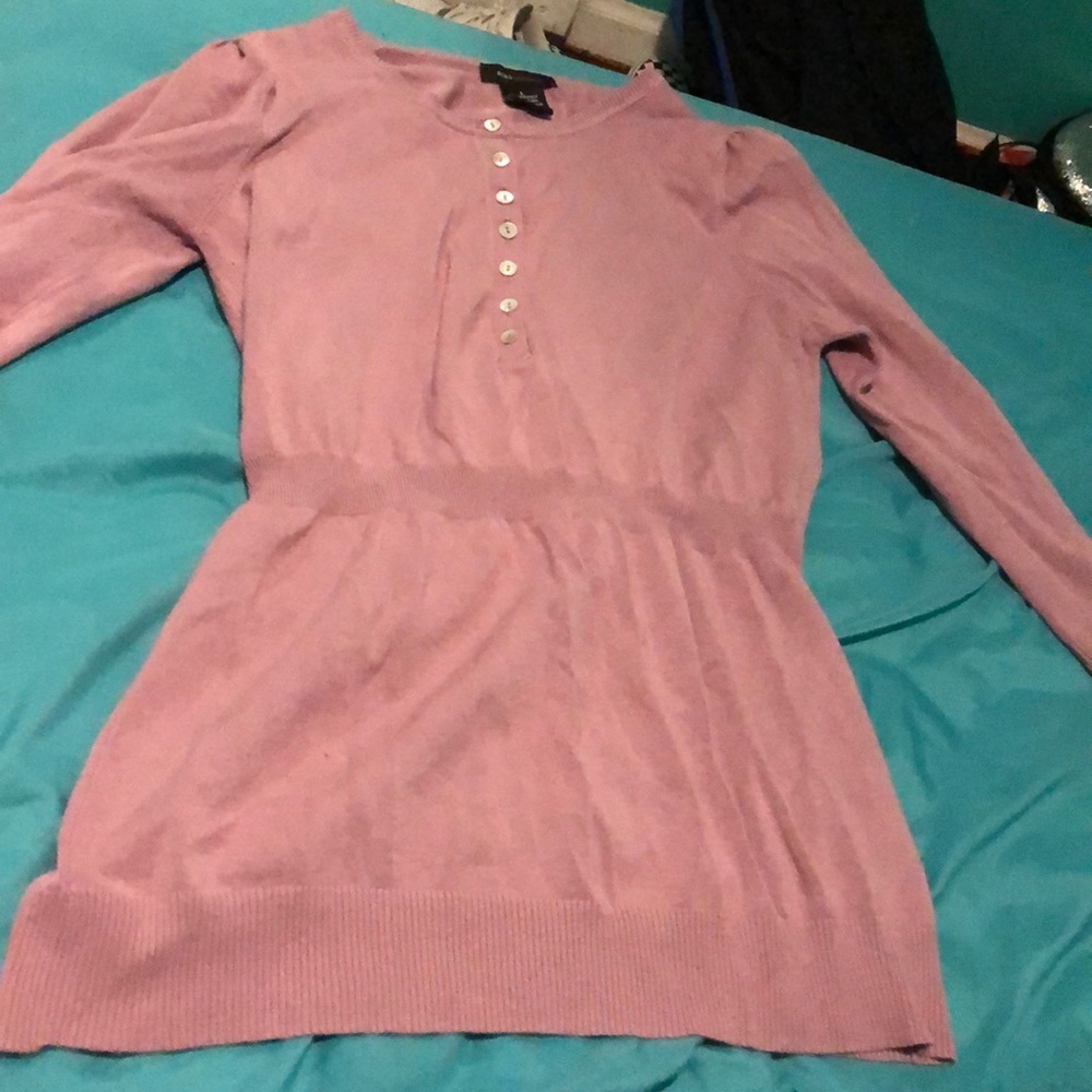 very flattering. on the tighter side. long sleeved